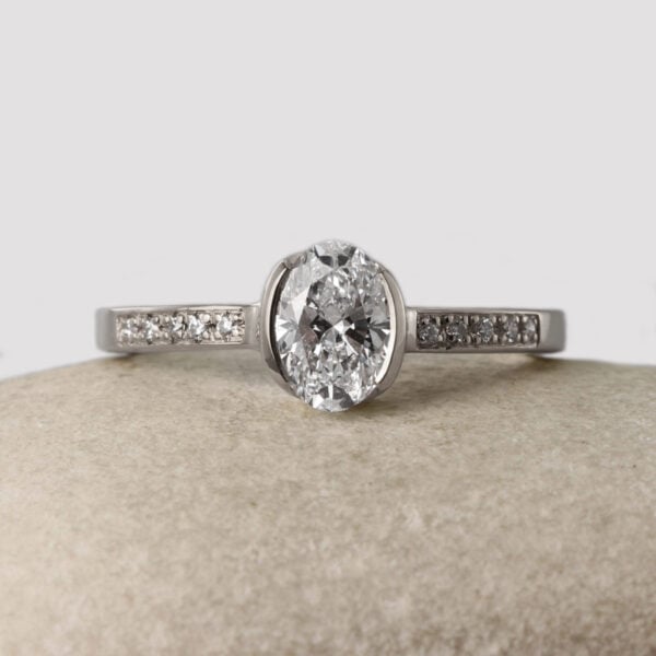 The Faughan: 950 Platinum Partial Collet Oval 1.0ct Lab Grown Diamond Engagement Ring with Pave Set Shoulders