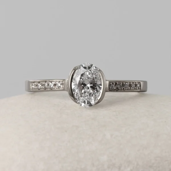 The Faughan: 950 Platinum Partial Collet Oval 1.0ct Lab Grown Diamond Engagement Ring with Pave Set Shoulders