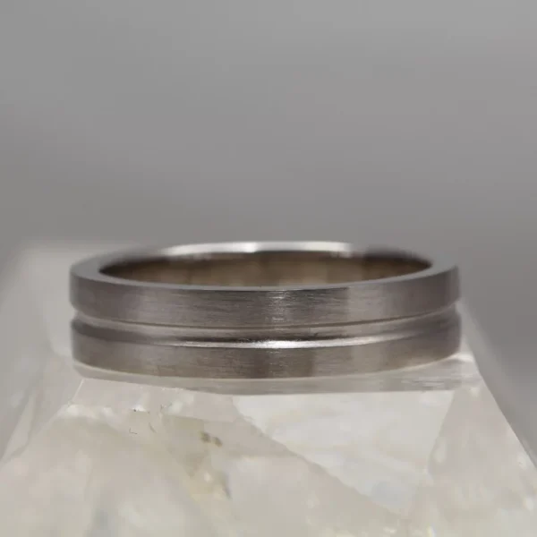 The Crossaig: Recycled 950 Platinum Channel cut Wedding Ring with Matt finish