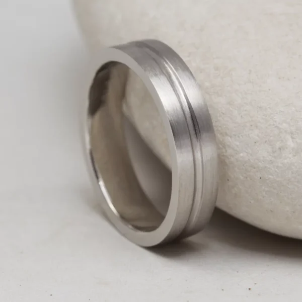 The Crossaig: Recycled 950 Platinum Channel cut Wedding Ring with Matt finish