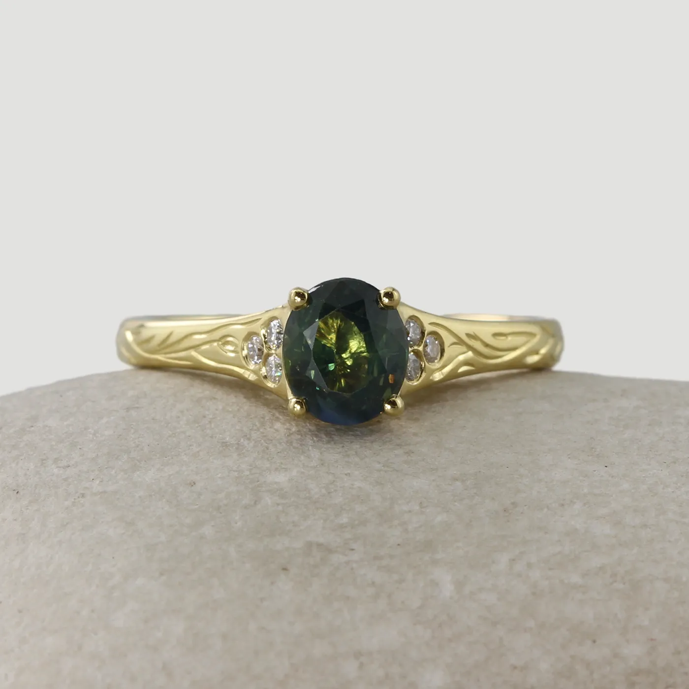 Bespoke Teal Sapphire Engagement ring with hand engraving